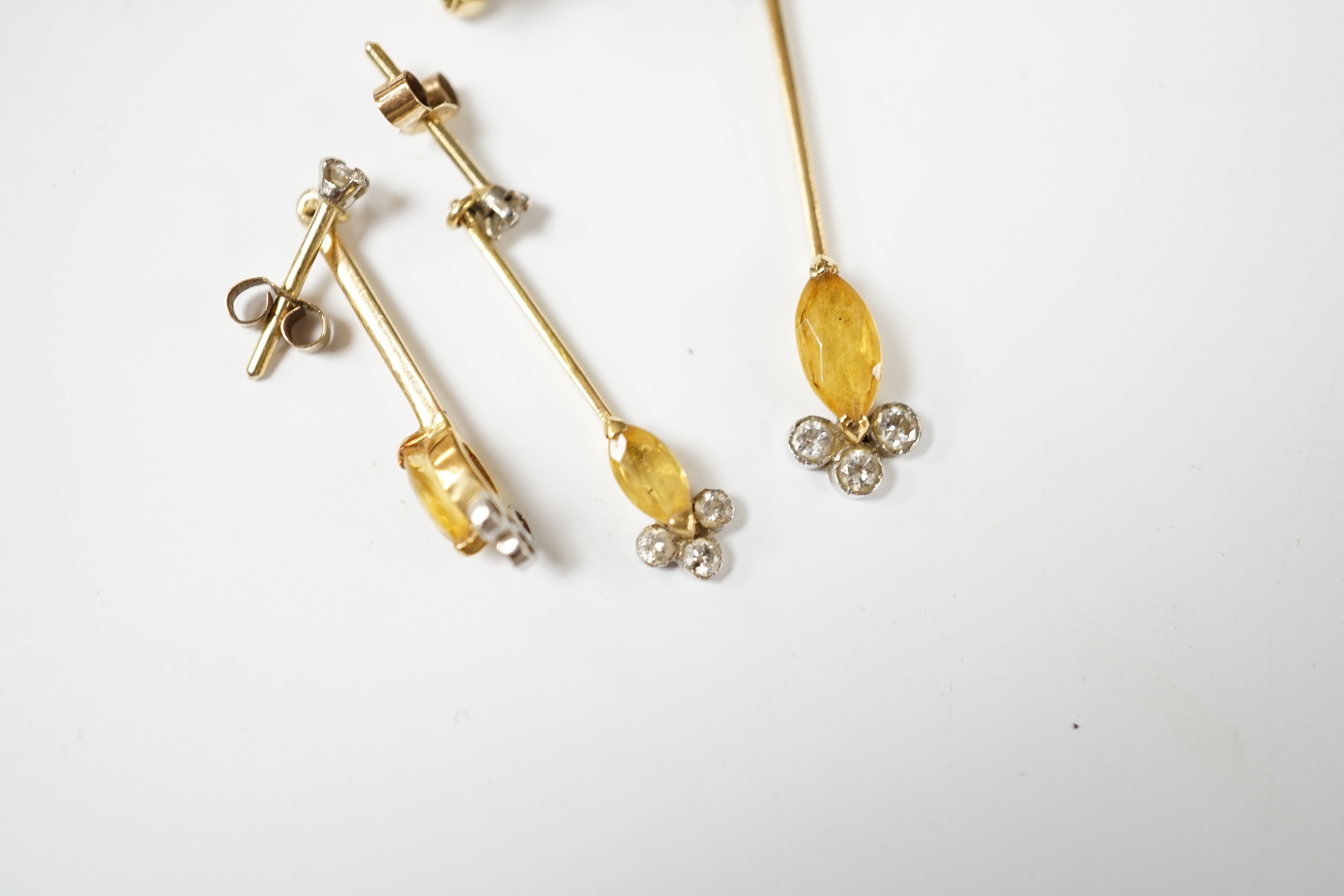 A yellow metal, citrine and diamond set suite of jewellery, comprising a ring (stamped 18ct), size O, pair of earrings, and a pendant of a 9ct chain. Condition - fair